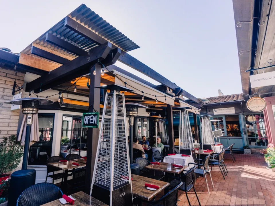 Patio heaters under a modern pergola
