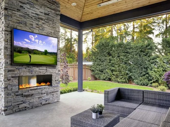 Outdoor TV mounted on a covered patio